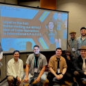 photo of seven Men of Color in front of a presentation screen
