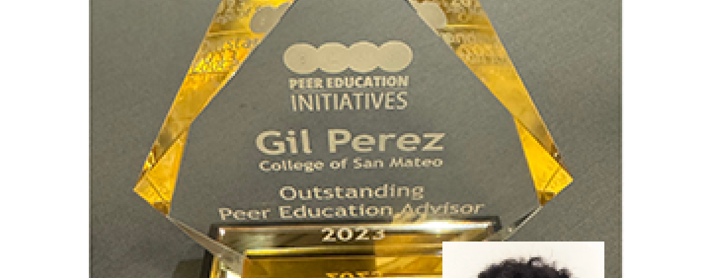 triangular glass award with headshot of Gil Perez in lower right corner