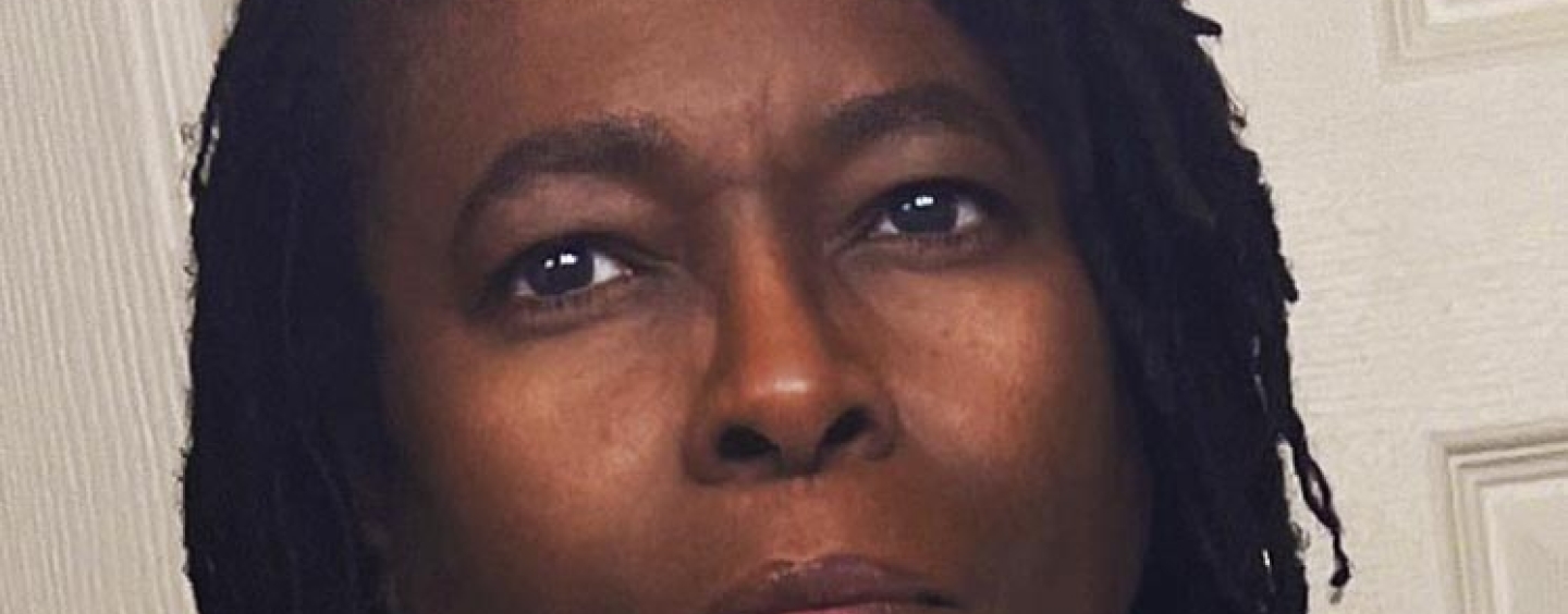 photo of Marcia Miller, black braids, brown skin, white turtleneck